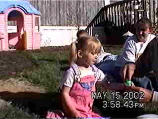 Carrie playing with bubbles - 5/15/02