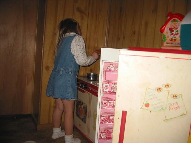 Carrie playing in her kitchen.
