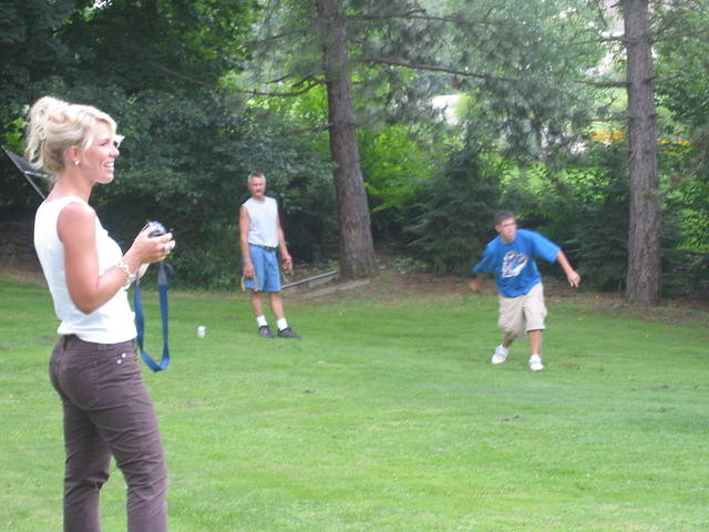 Jodee and I taking pictures of the guys playing horseshoes