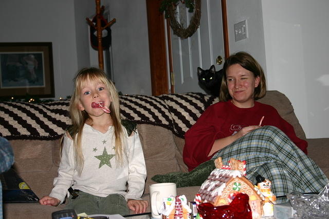 Carrie and Michelle eating candy canes.