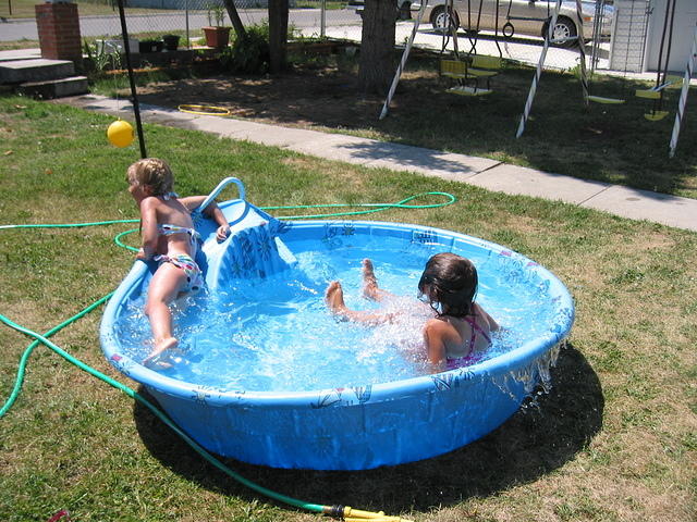 Carrie and Isabelle both falling into the pool.