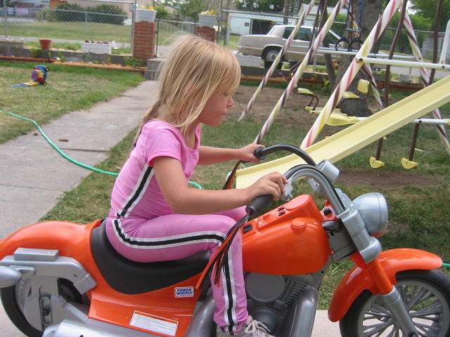 A girl and her Harley.