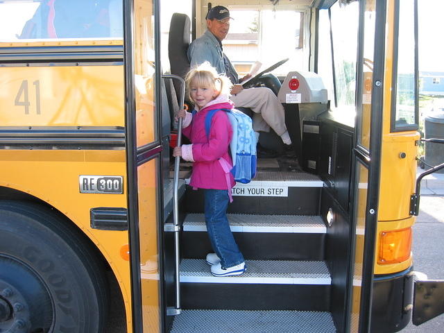 Carrie climbing on the bus.