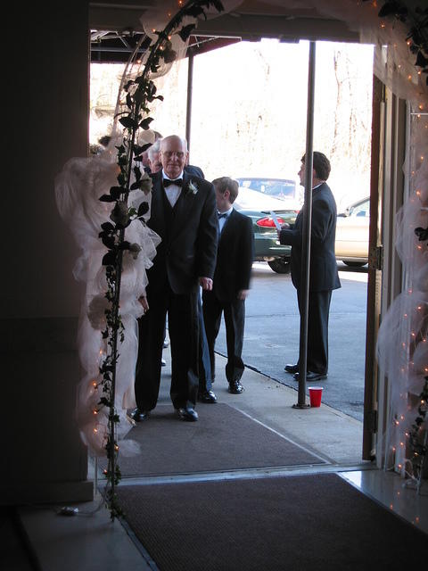The wedding party waiting outside.