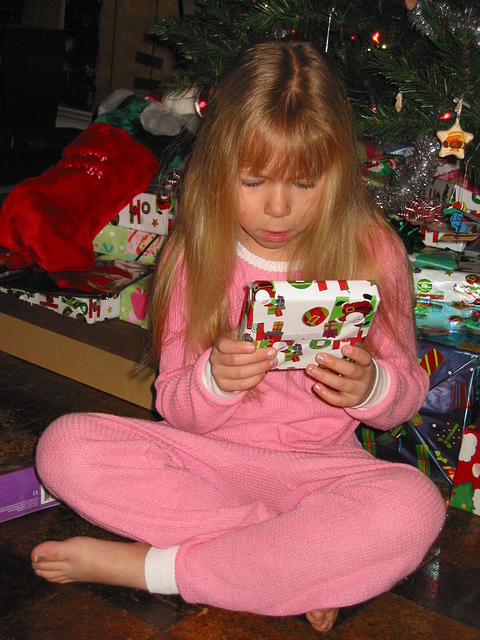 Carrie checking out a present