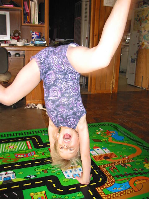 Carrie practicing cartwheels... She's getting much better, but needs to work on keeping her legs straighter! :)