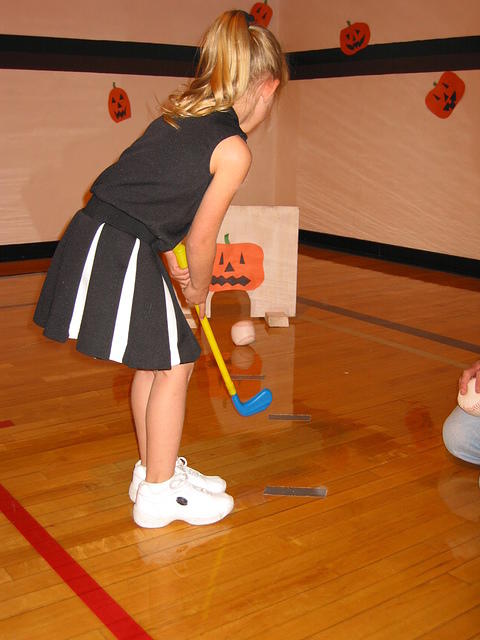 Carrie playing some silly golfish game.