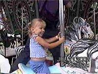 Carrie on the merry go round - 7/27/02