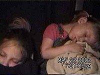 Amber and Carrie sleeping in the car after a hard day of playing! - 5/22/02
