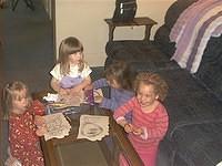Carrie, Emma, Desiree, and Jasmine coloring at Gramps' house.