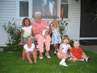 Grandma and all her great grandchildren.  Desiree, with Jasmine in front.  Grandma is holding Kaden, Carrie of course, and in fr