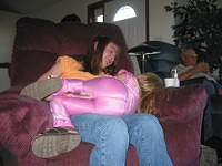 Carrie climbing on Alicia's lap. 10/5/03