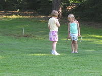 Emma and Carrie playing horseshoes