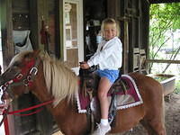 Carrie riding the pony