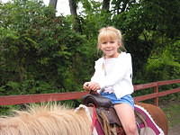 Carrie riding the pony