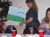 Aunt Dawn carrying the painting Amber painted for Gram and Pap.