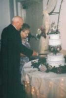 Gram and Pap cutting the cake