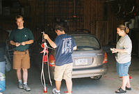 Shawn, Kevin and Michelle, washing the car.