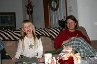 Carrie and Michelle eating candy canes.