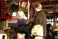 Carrie and Shawn on the carousel.