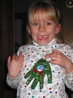Carrie shows me the Christmas ornament she made for me at school.