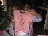 Mom shows me a shirt Carrie got for Christmas.