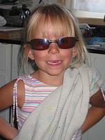 Carrie trying on Krissy's sunglasses.