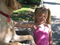 Carrie visiting with this dog down the street, who seems really very nice.  I missed the pic I wanted though.