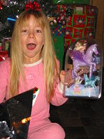 I love the look on Carrie's face here.. with the bow on her head.. she got a Magic of Pegasus Kelly doll.
