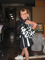 Carrie showing off her cheerleading uniform.