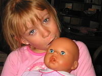 Carrie kissing baby Annabell.