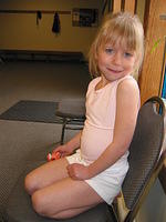 Carrie eating skittles, waiting for her cheerleading class to start.