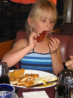 Carrie, eating out with Mom and Grandmom.
