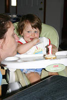 Joleigh and Mommy blow out the candles.