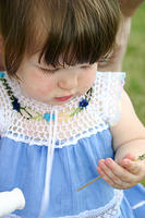 Joleigh, fascinated by the dandelion